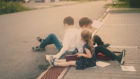 schoolboys in shirts play near young sister after lessons