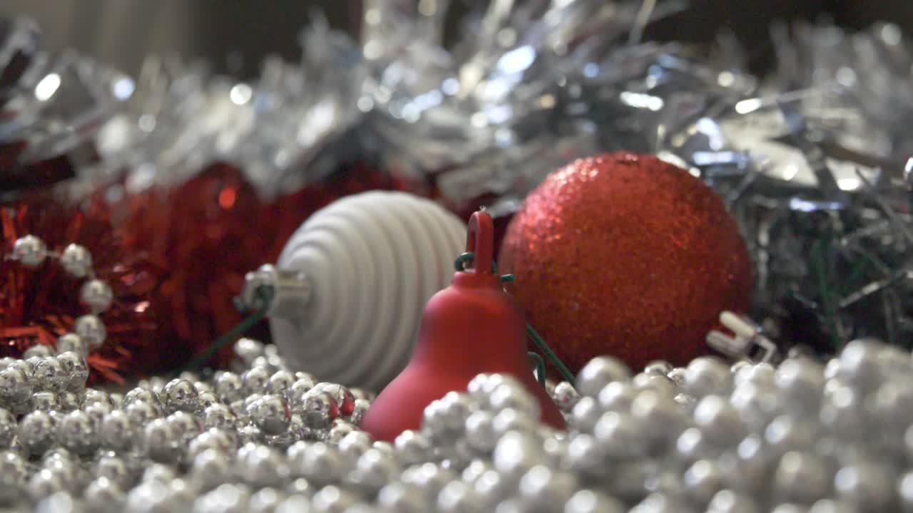 red bell bauble falling on the floor