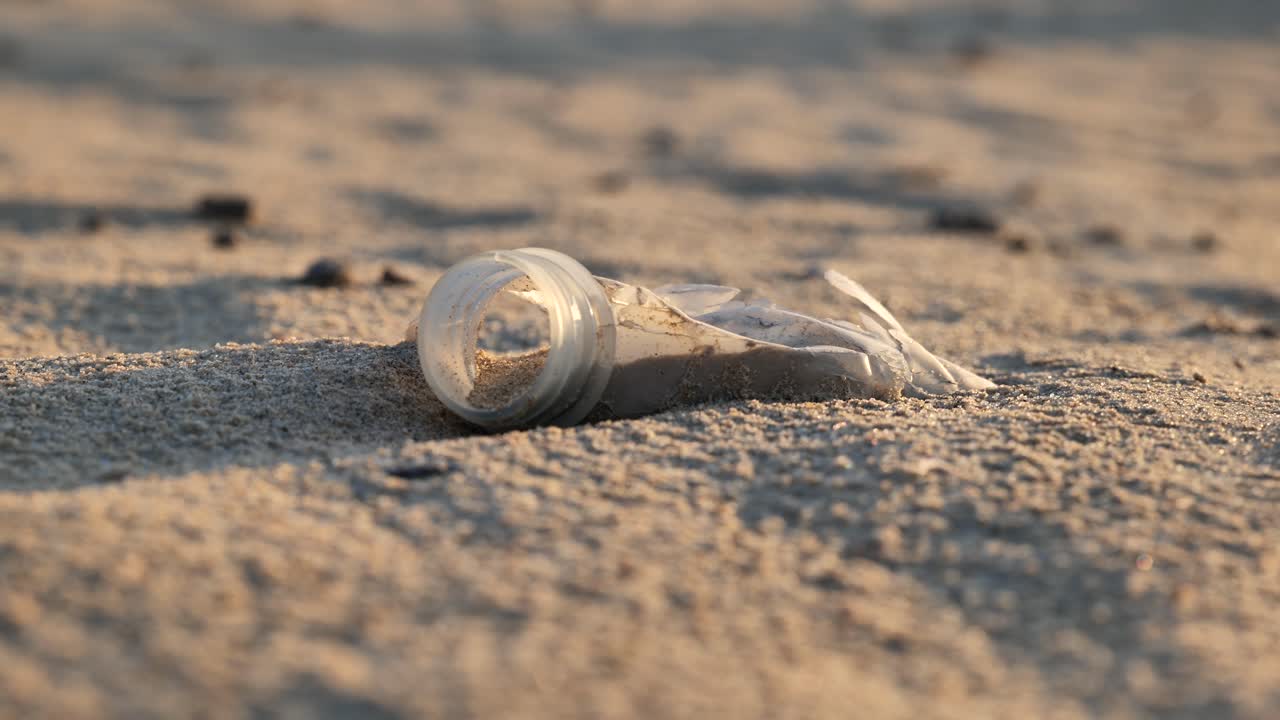 Close up shot of neck bottle on sand in desert