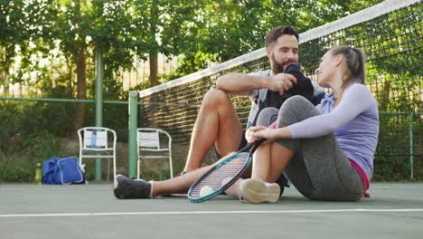 Video-of-happy-caucasian-couple-on-having-break-the-court
