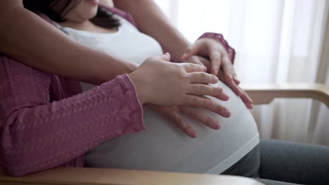 pregnant couple feels love and relax at home.