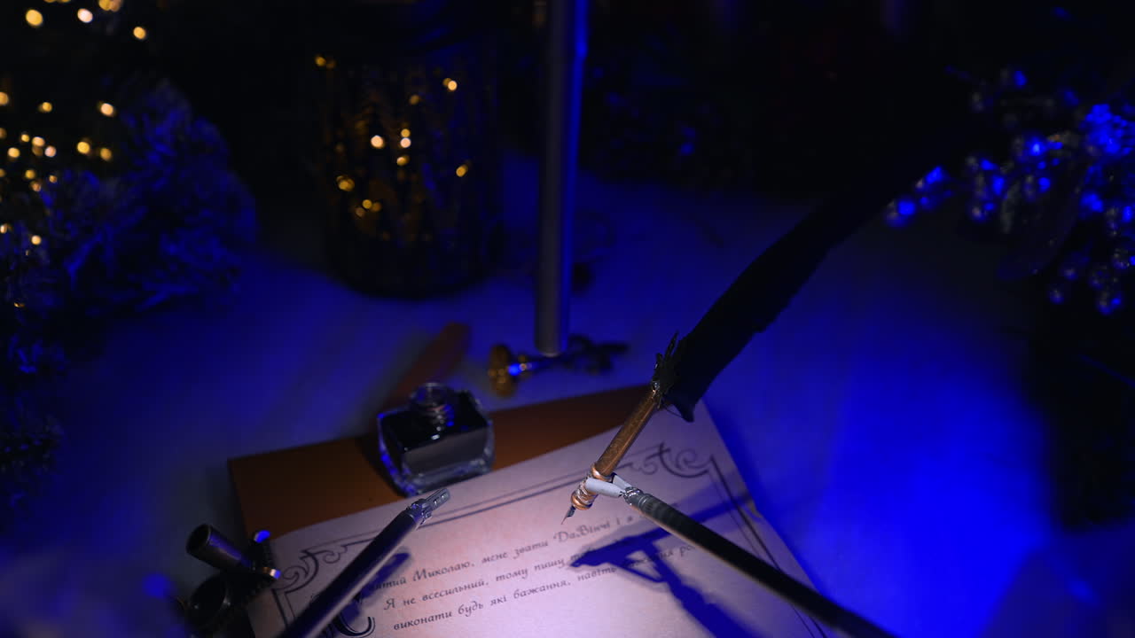Delicate high-precise robotic forceps holding old-fashioned writing pen over the paper. Christmas decorations at backdrop in dark surgery room.