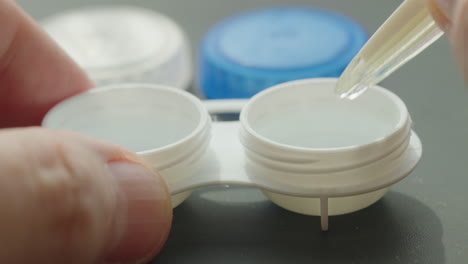 putting contact lenses in a case