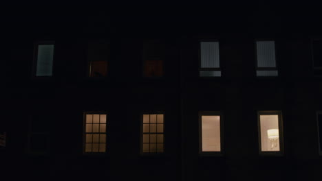 lights from windows of a building at night