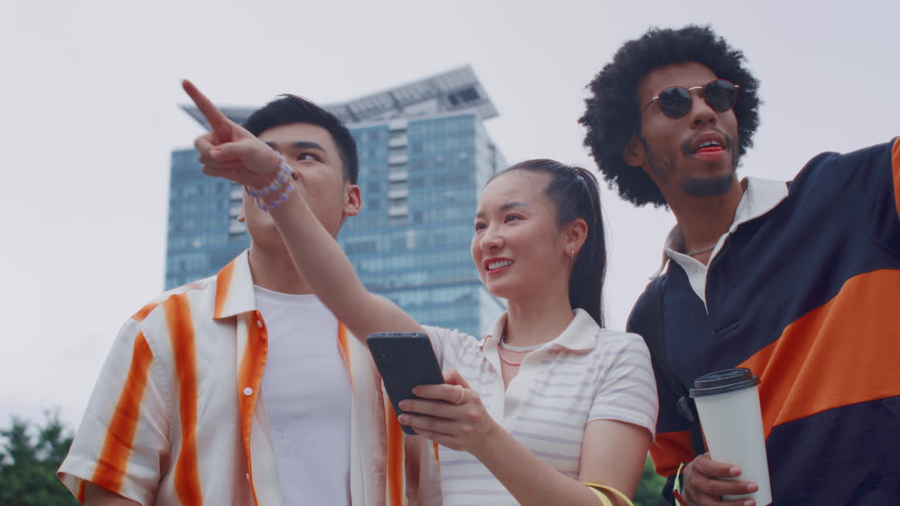 Diverse Friends Checking City Map on Smartphone
