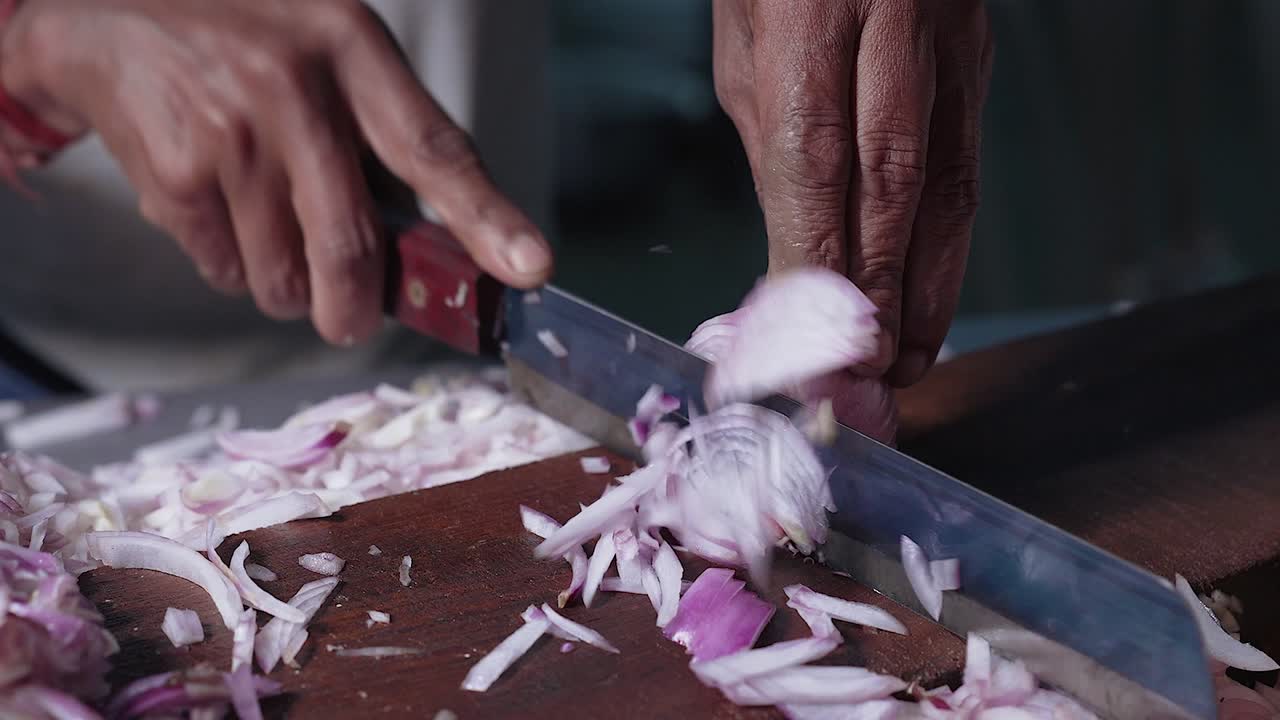 Close-up of man hand chopping onion faster