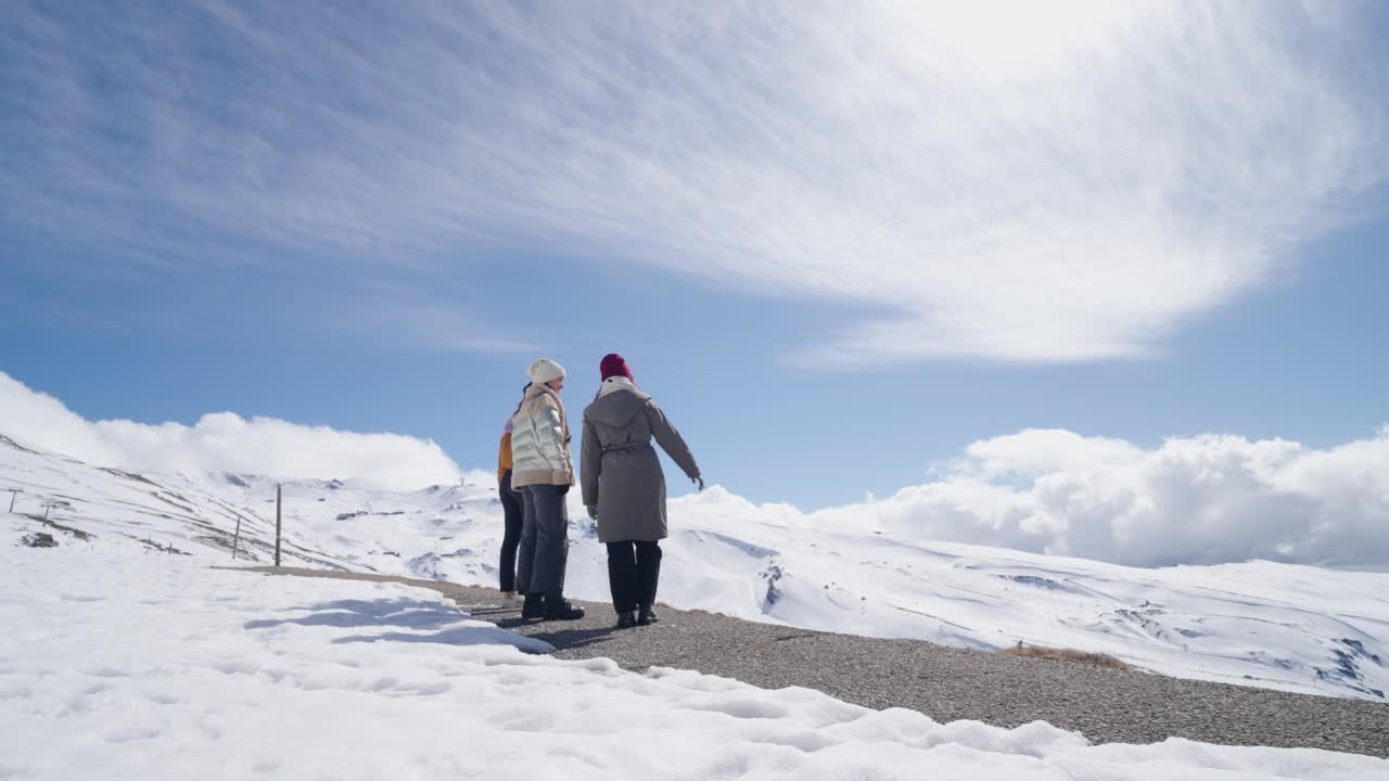 People enjoying the mountain view in winter
