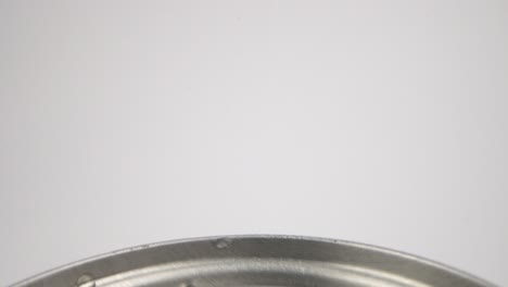 soda can top with dewdrops close-up