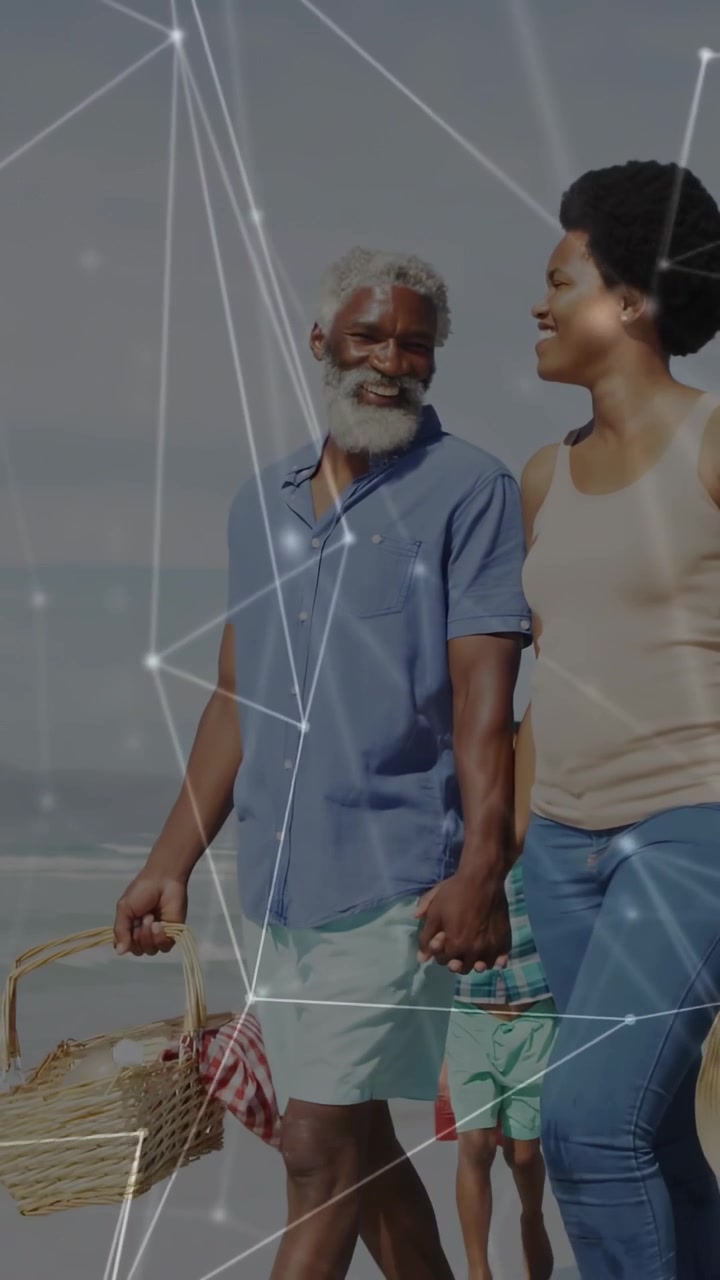 Vertical video: Senior man entering frame, causing tech net overlay, holding basket joining family