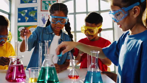 Children conducting a science experiment in school