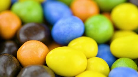 chocolate coated peanuts on a rotating table (seamless loopable)