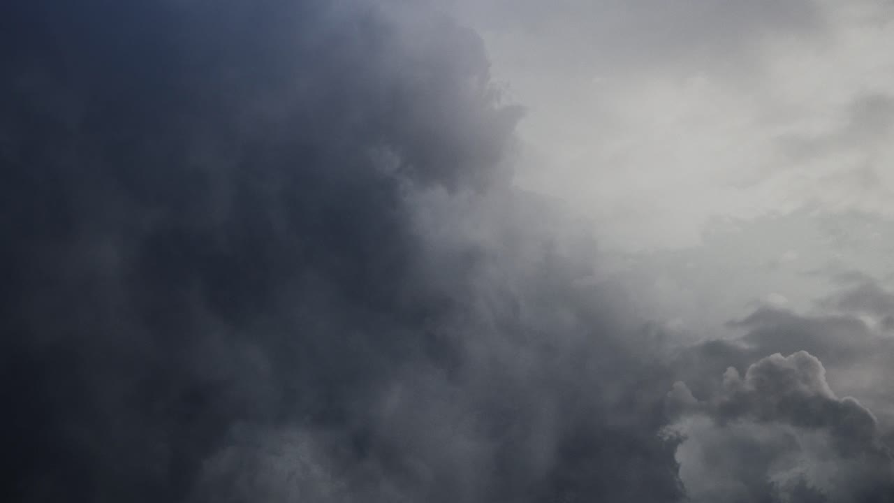 POV flying through dark and moving cumulonimbus clouds, thunderstorm