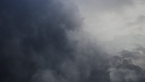 pov flying through dark and moving cumulonimbus clouds, thunderstorm
