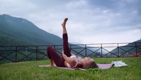 woman practicing yoga outdoors