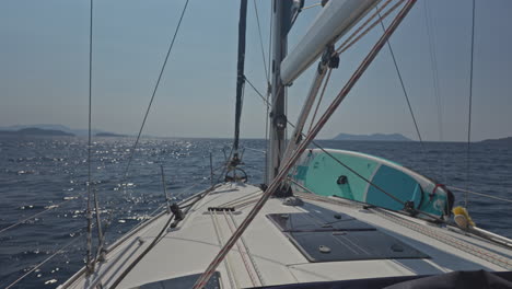 view from a yacht of a greek island at sunrise