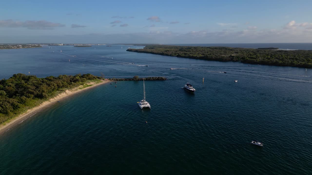 Aerial views of luxury yachts near Wavebreak Island and the Broadwater on the Northern end of the Gold Coast, Australia