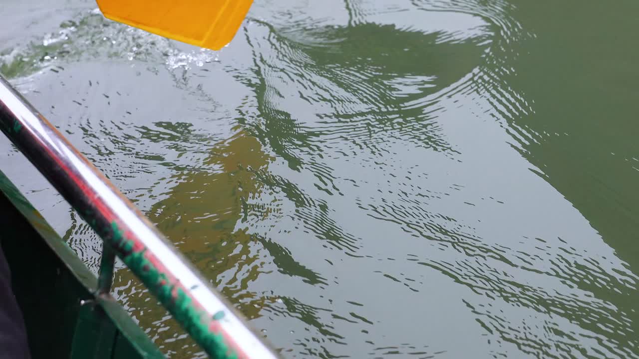 Oar movement in tranquil Vietnamese waters