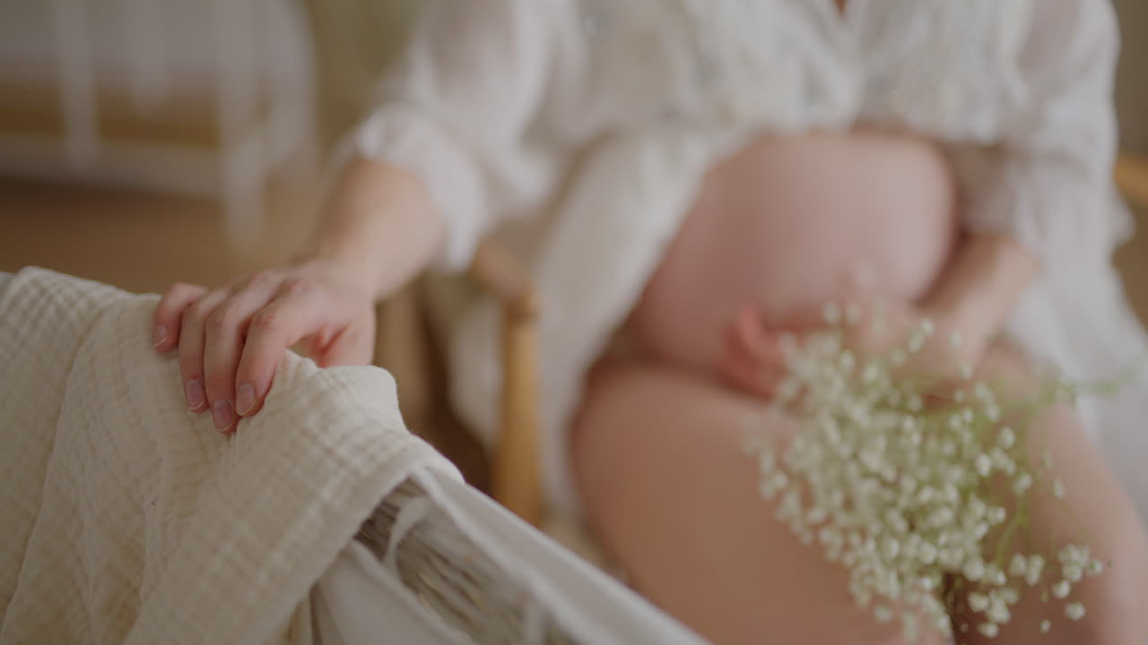 Pregnant Woman Cradling Baby to Sleep with Flowers