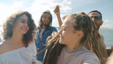 friends having fun by the lake