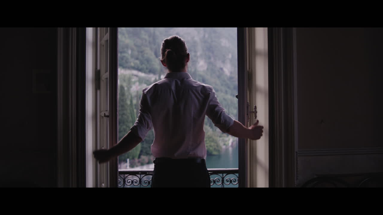 Man looking at a scenic view from a window