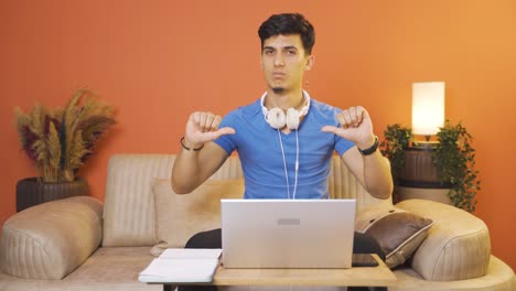 Negative-expression-of-man-using-laptop.