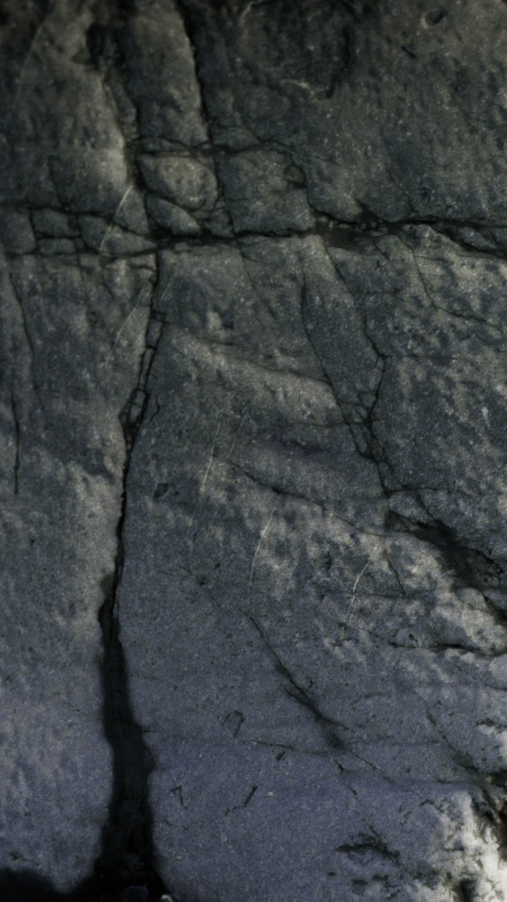 Rock surface with cracks and patterns in a natural environment
