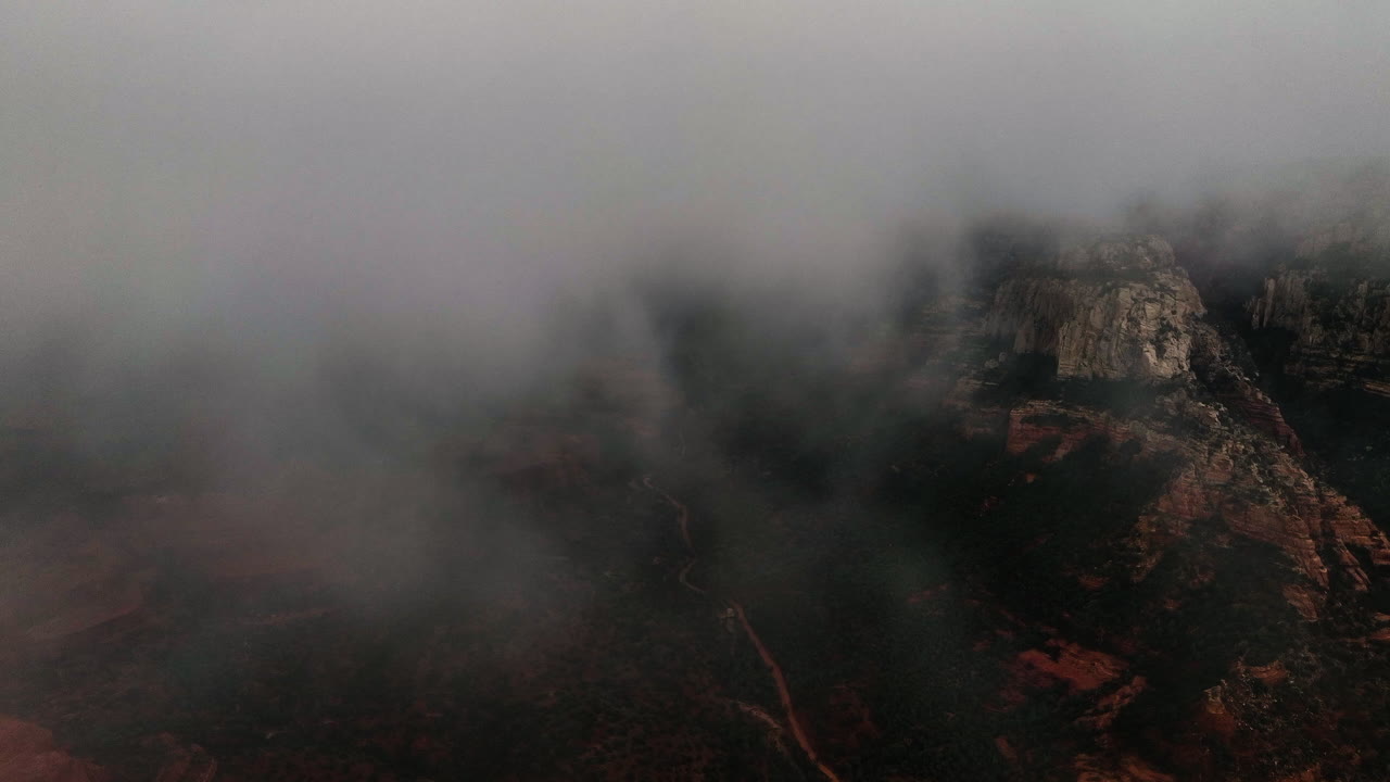Fog Clouds Covering Red Rock Formations In Sedona, Arizona