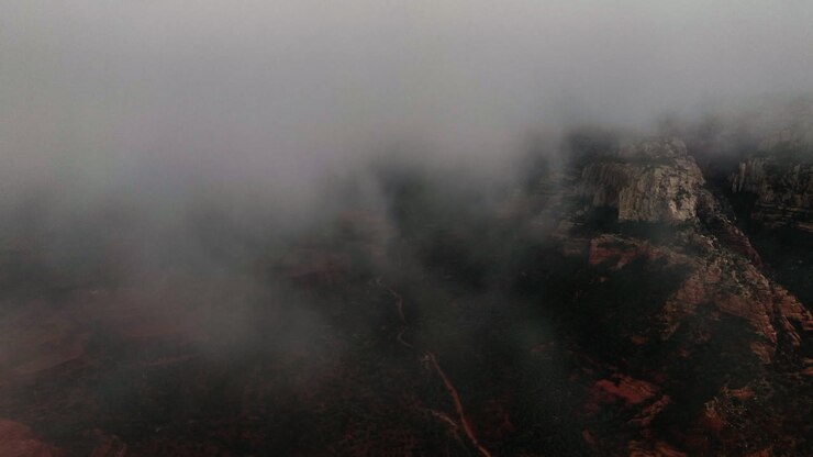 Fog Clouds Covering Red Rock Formations In Sedona, Arizona
