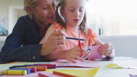 Front-view-of-Caucasian-woman-playing-with-her-daughter-at-home