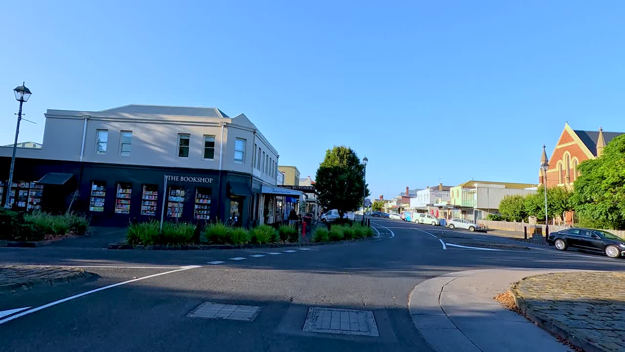 A serene drive through Bellarine, Victoria, showcasing quiet streets, historic buildings, and clear blue skies in bright daylight