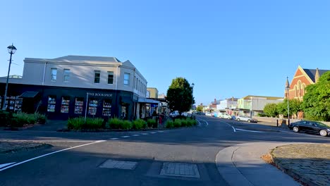 a serene drive through bellarine, victoria, showcasing quiet streets, historic buildings, and clear blue skies in bright daylight