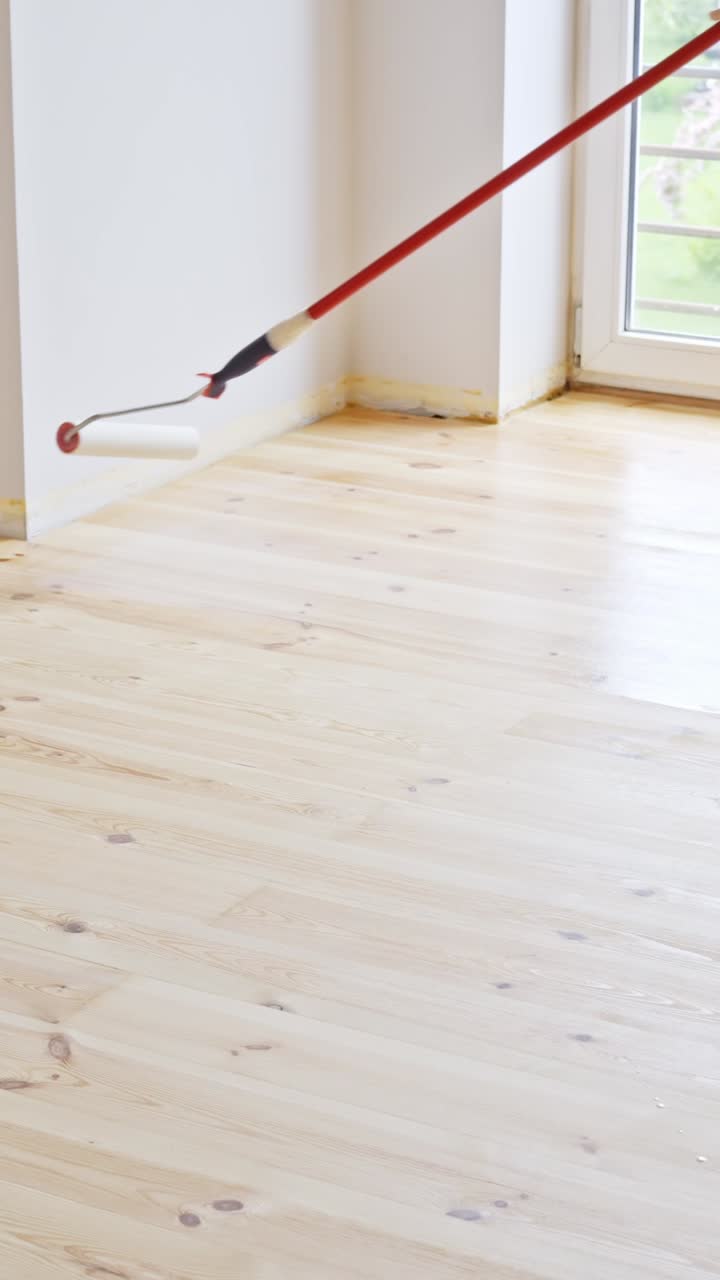 Freshly varnished hardwood floor in a bright room, DIY renovation vibe
