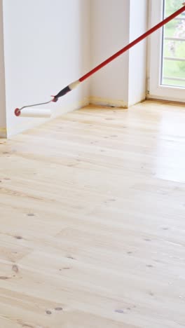 freshly varnished hardwood floor in a bright room, diy renovation vibe