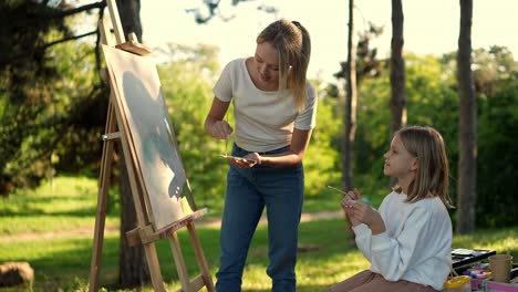 girls painting outdoors