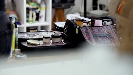 makeup tools on a table in a beauty studio setting