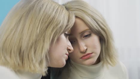 stressed young woman thinking about health problems, looking away.