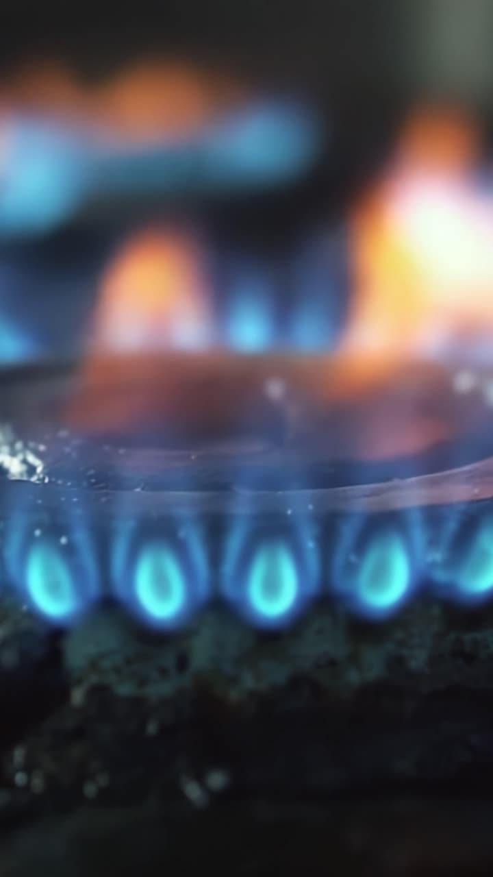 A Captivating Display of Natural Flames and Vibrant Color from a Gas Burner Showcasing the Intricacies of Flame Dynamics and Heat Production
