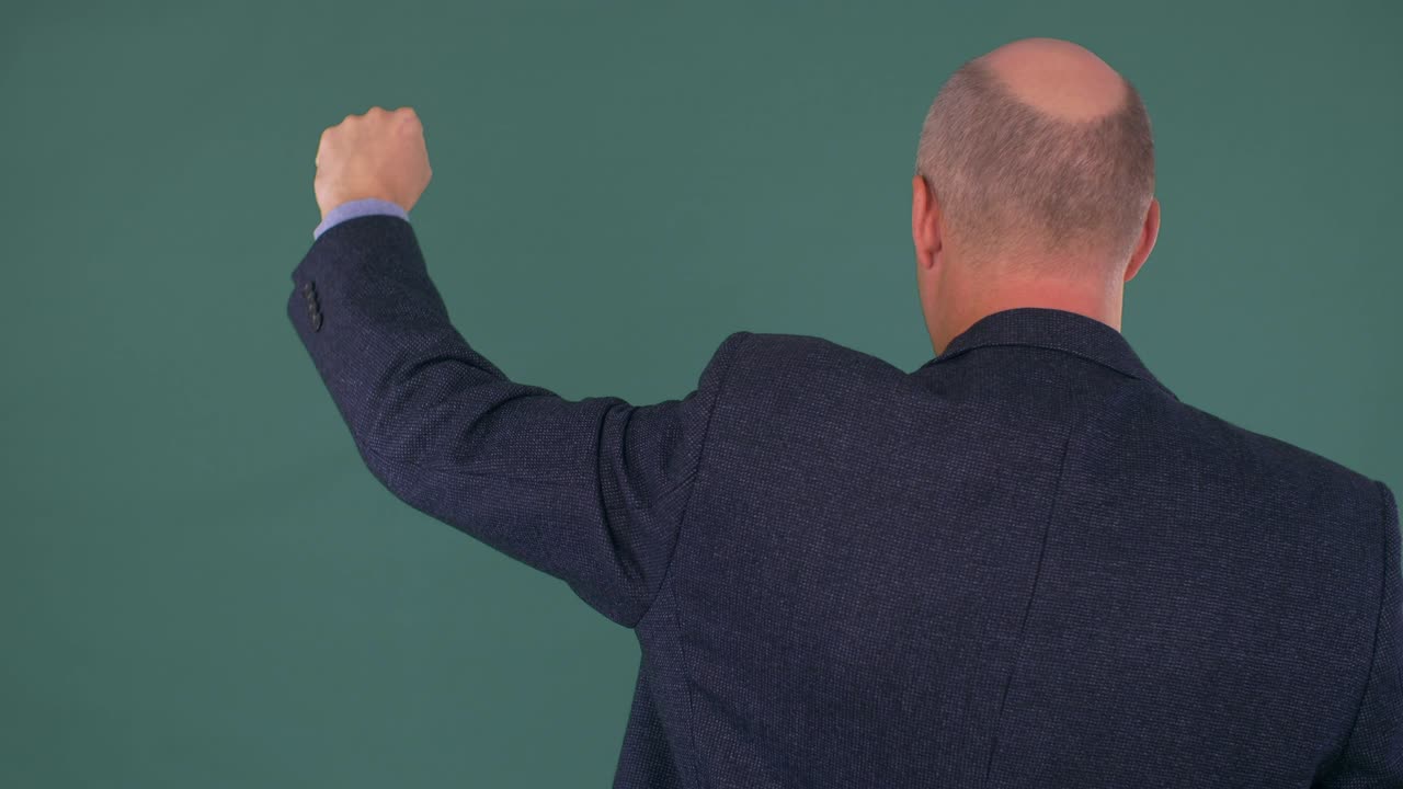 bald businessman protesting with fist up