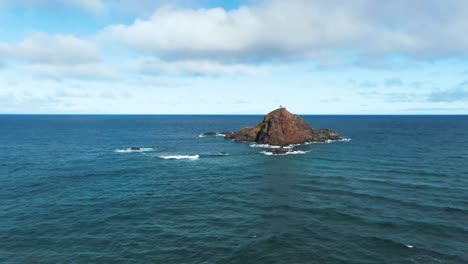 aerial orbit shot of alau island, an seabird sanctuary in maui coastline