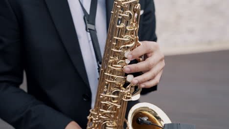 close-up of saxophone in musician's hands