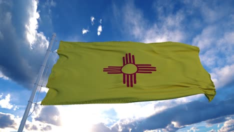 new mexico flag on a flagpole waving in the wind, blue sky background. 4k