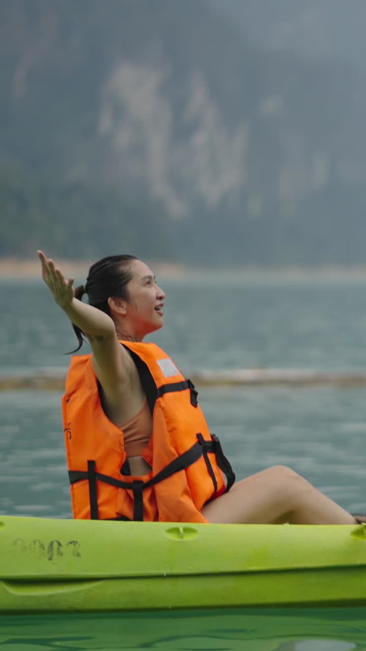Woman kayaking on a lake