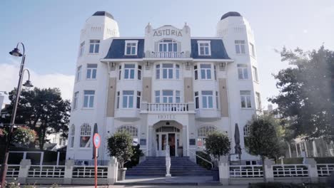 facade of hotel astoria building with belle epoque architecture in coastal village de haan, belgium