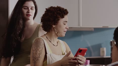 two women talking in a kitchen