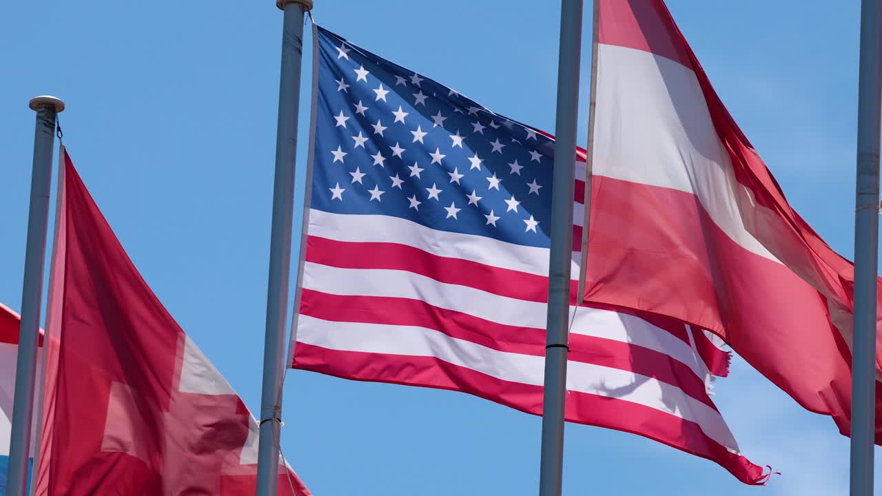 American and Austrian flags fluttering in the breeze