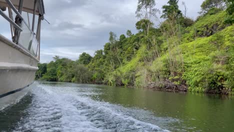 low angle over the water from boat traveling up river in eastern madagascar