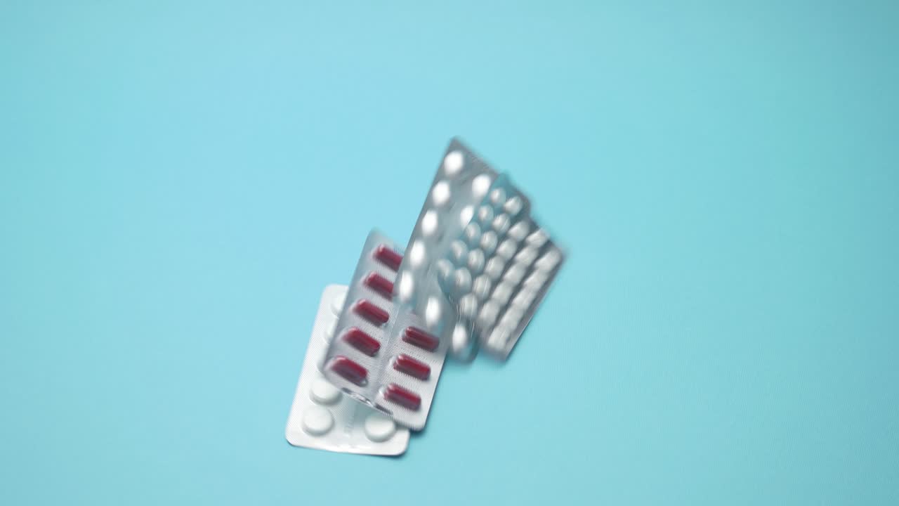 Drops the medicine on blue background