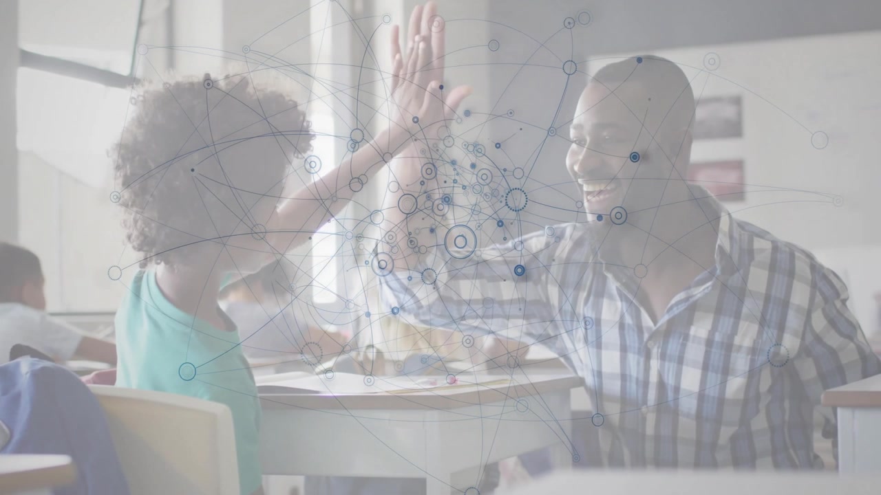 Male teacher giving high-five to girl student in classroom, showcasing translucent network overlay
