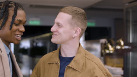 two men interacting in a store