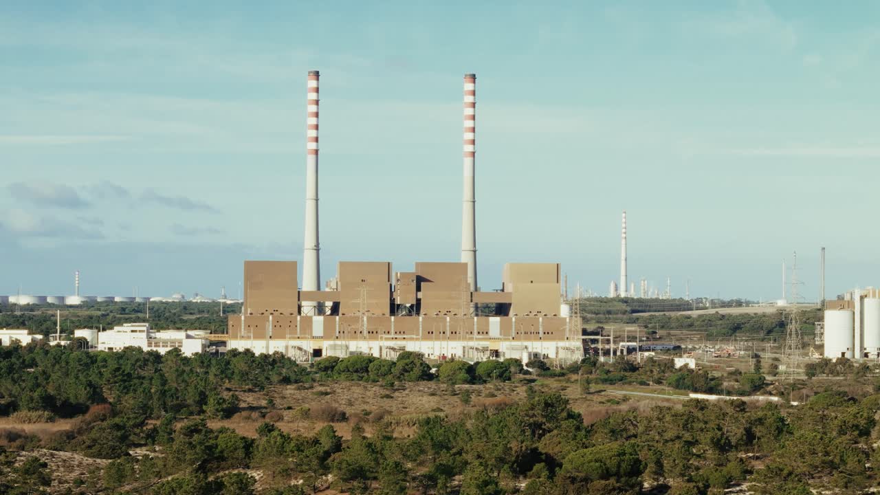 Massive factory with tall chimneys in Portugal, aerial view